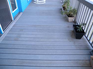 A composite deck marred by stains.